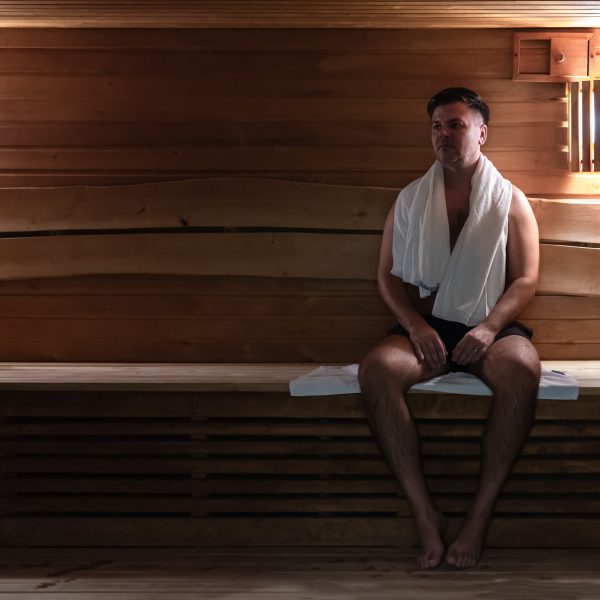 Man relaxing in the sauna